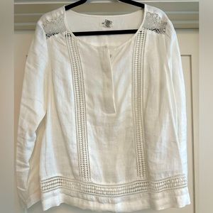 White linen blouse with crocheted cut outs.